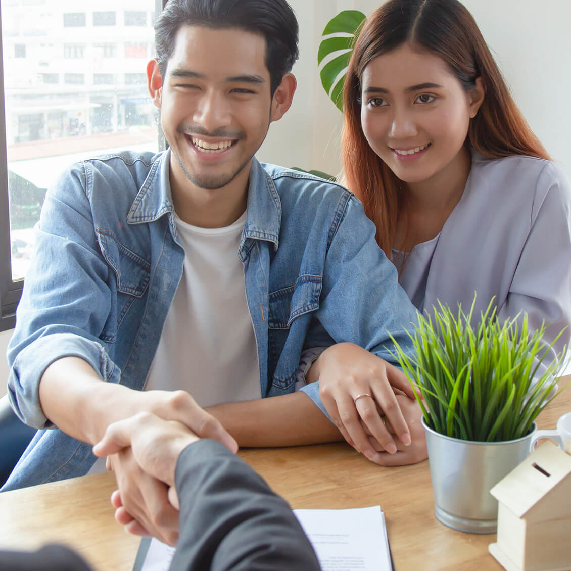 Couple Completing Mortgage Application