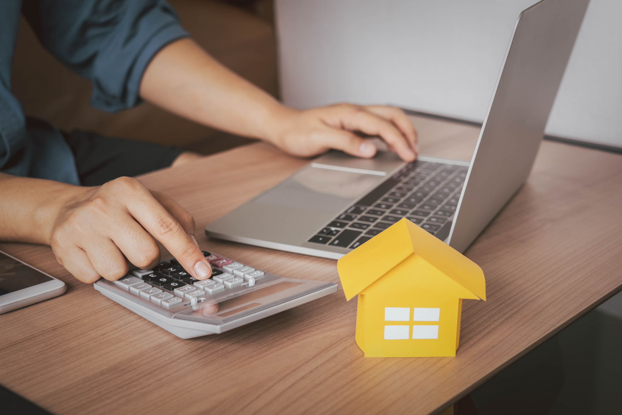 Image of man calucalting Denver FHA home loan rates